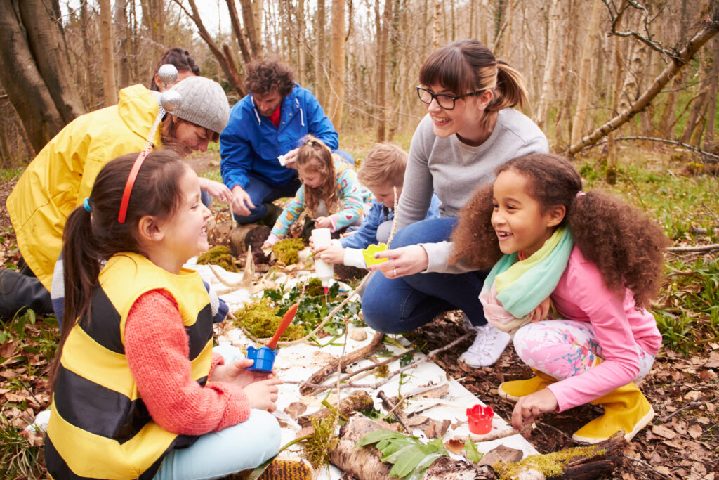 Group Looking For Minibeasts At Activity Centre