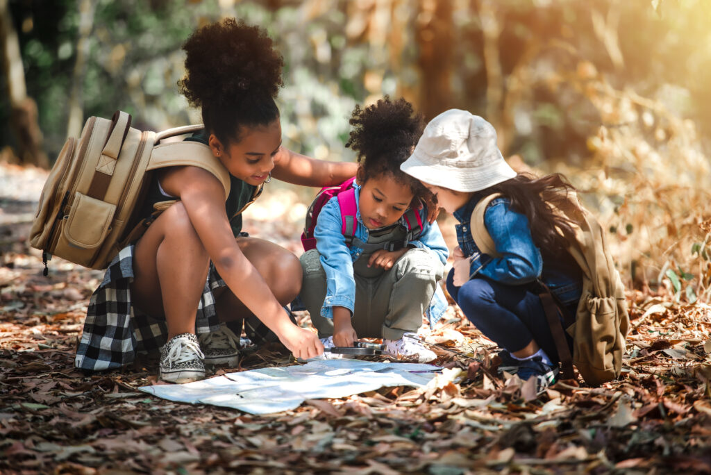 Journey Concept of Explorer Kids Travelling and Hiking in the Forest with Family Among Nature in Vacation Summer